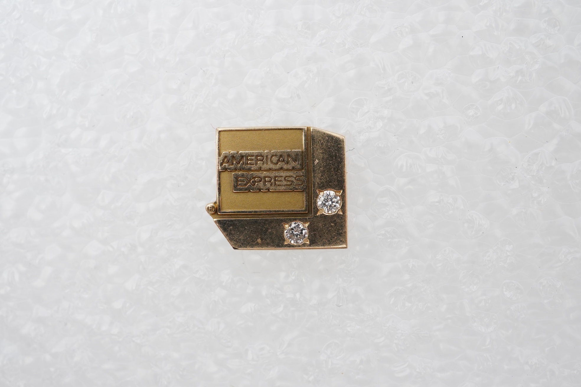 A gold and diamond novelty pin